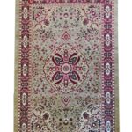 Intricately designed rug named "Mughal Garden" featuring a central floral medallion in crimson, beige, and black tones, inspired by traditional Mughal artistry and garden motif