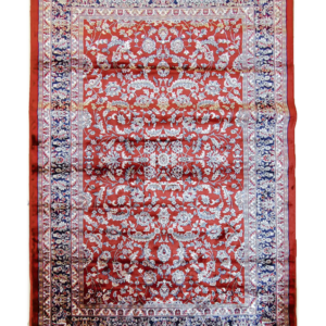 Handcrafted luxury wool rug ‘Persian Ruby,’ made in India featuring ivory floral arabesques on a rich scarlet-red field.