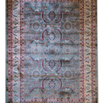 Luxury silver handmade rug with intricate Mughal-inspired floral patterns in blue, blush, and ivory.