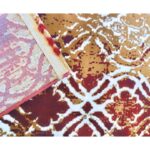 close-up of the Autumn Horizon Rug featuring organic patterns in shades of brown, beige, and white, with a deep red border. A luxury handmade rug available in Mumbai, India.