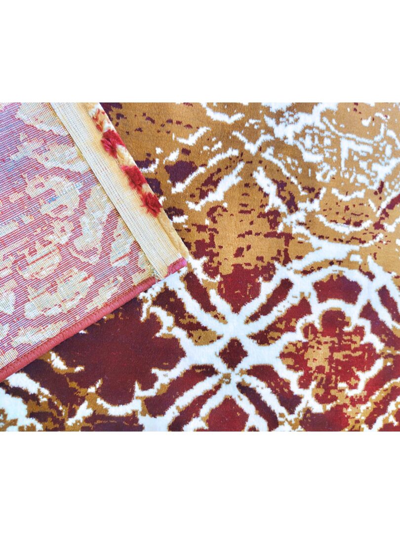 close-up of the Autumn Horizon Rug featuring organic patterns in shades of brown, beige, and white, with a deep red border. A luxury handmade rug available in Mumbai, India.