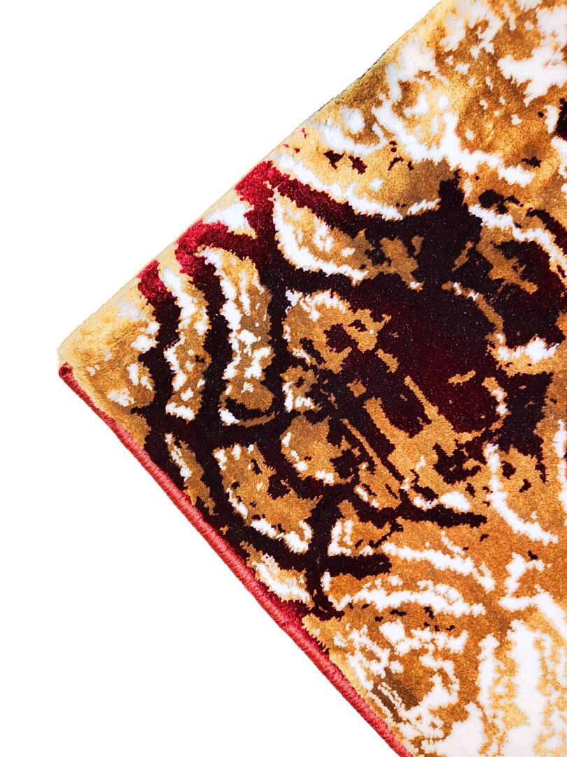 The Autumn Horizon Rug features an intricate ornamental floral design in gold, red, and white. A luxurious handmade rug for elegant home decor.
