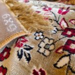 Discover the Golden Minaret Rug, a luxury handmade Persian-style rug with intricate floral and geometric patterns in red, blue, and beige. Perfect for elegant home decor.
