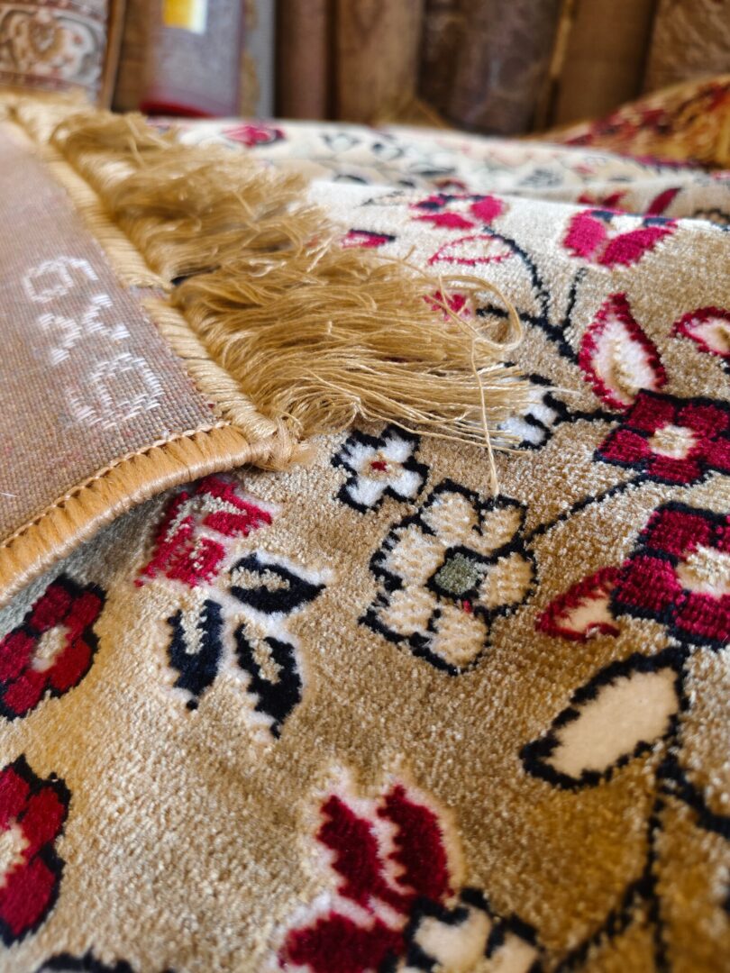 Discover the Golden Minaret Rug, a luxury handmade Persian-style rug with intricate floral and geometric patterns in red, blue, and beige. Perfect for elegant home decor.