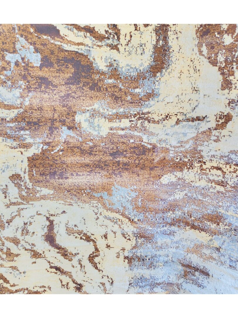 Close-up of the Milk Desert Rug featuring an abstract pattern in brown, purple, and blue tones, with a folded corner revealing its woven underside.